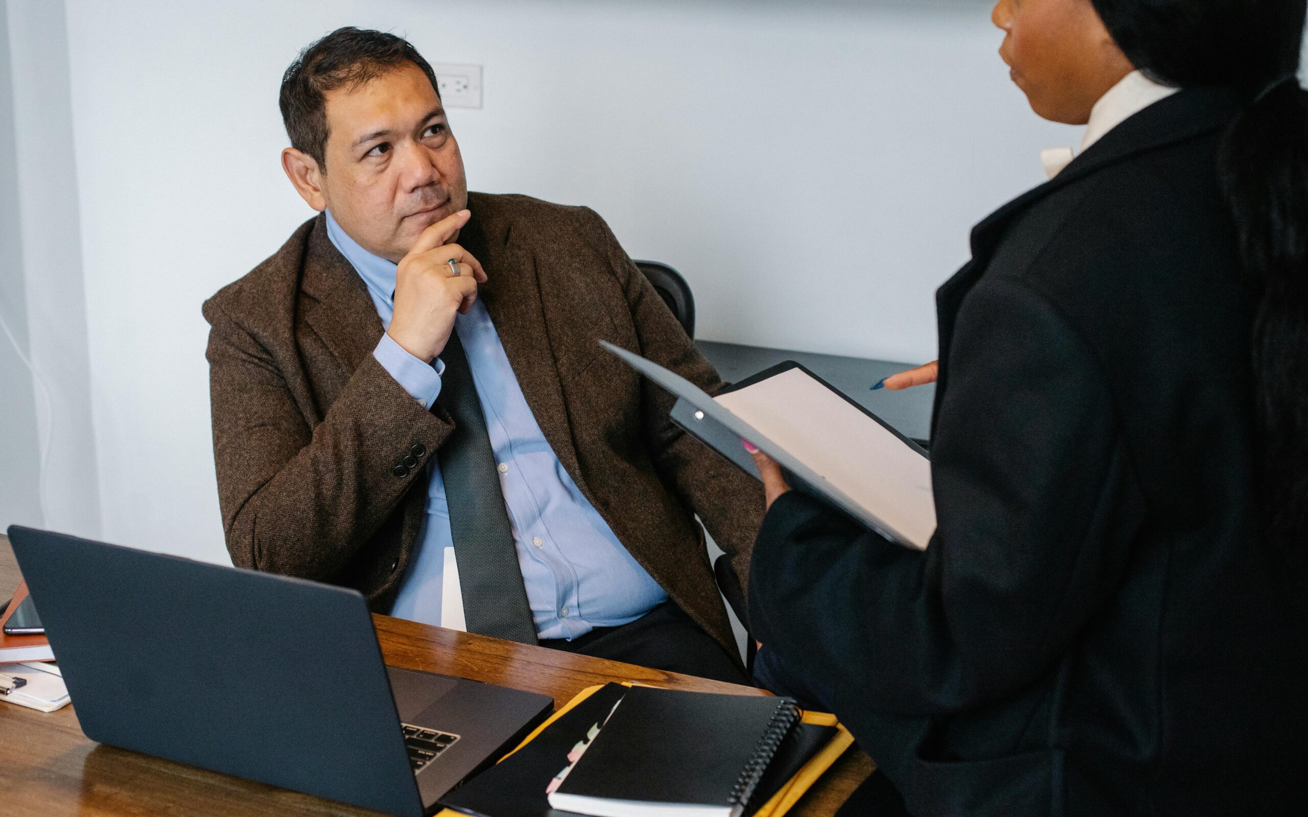 a manger listening to a briefing